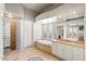 Elegant bathroom with soaking tub, glass block shower, and double vanity at 12294 N 88Th Pl, Scottsdale, AZ 85260