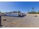 Spacious backyard with gravel and a view of the home at 126 E Northern Ave, Phoenix, AZ 85020