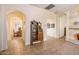 Bright hallway with antique secretary and views into dining room at 12963 S 183Rd Ave, Goodyear, AZ 85338