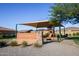 Community Greenspointe playground with shade structure and bench at 12963 S 183Rd Ave, Goodyear, AZ 85338