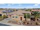 Single-story home with a two-car garage and landscaped front yard at 13036 W Fetlock Trl, Peoria, AZ 85383