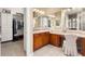 Main bathroom with large vanity, walk-in closet and additional storage at 13036 W Fetlock Trl, Peoria, AZ 85383