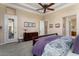 Main bedroom with dresser and access to private door at 13036 W Fetlock Trl, Peoria, AZ 85383