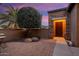 Brick paved courtyard with a seating area; inviting entry at 13036 W Fetlock Trl, Peoria, AZ 85383