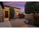 Brick paved courtyard with seating area and desert landscaping at 13036 W Fetlock Trl, Peoria, AZ 85383