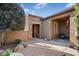Brick paved courtyard with seating area and desert landscaping at 13036 W Fetlock Trl, Peoria, AZ 85383