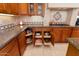 Organized kitchen with pull-out shelving and corner storage at 13036 W Fetlock Trl, Peoria, AZ 85383