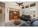 Bright living room with comfortable seating and built-in shelving at 13036 W Fetlock Trl, Peoria, AZ 85383