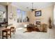 Living room with fireplace and comfortable seating at 13036 W Fetlock Trl, Peoria, AZ 85383