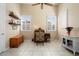Home office with built-in shelving and large windows at 13036 W Fetlock Trl, Peoria, AZ 85383