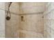 Shower stall with built-in seat and glass enclosure at 13036 W Fetlock Trl, Peoria, AZ 85383