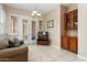 Cozy sunroom with built-in cabinetry and French doors at 13036 W Fetlock Trl, Peoria, AZ 85383