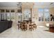 Wet bar with granite countertop and wooden cabinetry at 13036 W Fetlock Trl, Peoria, AZ 85383