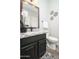 Elegant powder room with granite vanity and modern fixtures at 14309 W Verde Ln, Goodyear, AZ 85395