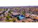 Community clubhouse with pool, tennis courts, and parking at 14610 W Black Gold Ln, Sun City West, AZ 85375