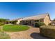 Spacious backyard with grassy area and desert landscaping at 15508 W Sky Hawk Dr, Sun City West, AZ 85375