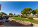 Backyard patio with grill and golf course view at 15508 W Sky Hawk Dr, Sun City West, AZ 85375