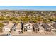 Aerial view showing a neighborhood with houses and mountain views in the background at 18215 N 5Th Ave, Phoenix, AZ 85023