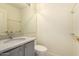 Bathroom with granite countertop vanity and a white toilet at 18215 N 5Th Ave, Phoenix, AZ 85023