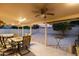 Covered patio with dining area and sitting area, overlooking a spacious backyard at 18807 N 2Nd Ave, Phoenix, AZ 85027