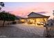 Spacious backyard with a checkerboard patio and covered seating area at 18807 N 2Nd Ave, Phoenix, AZ 85027