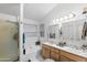 Bathroom with double sinks, bathtub, and shower at 18807 N 2Nd Ave, Phoenix, AZ 85027