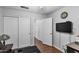 Bedroom with double doors and a TV at 18807 N 2Nd Ave, Phoenix, AZ 85027