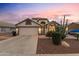 Single story home with attached garage and desert landscaping at 18807 N 2Nd Ave, Phoenix, AZ 85027