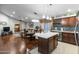 Open kitchen with island, hardwood floors, and dining area at 18807 N 2Nd Ave, Phoenix, AZ 85027