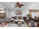 Bright living room with hardwood floors, sectional sofa, and ceiling fan at 18807 N 2Nd Ave, Phoenix, AZ 85027