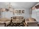 Living room with chandelier and comfortable seating at 18807 N 2Nd Ave, Phoenix, AZ 85027