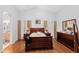 Bright main bedroom with hardwood floors and en-suite bathroom access at 18807 N 2Nd Ave, Phoenix, AZ 85027