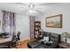 Home office with desk, couch, and built-in shelving at 18807 N 2Nd Ave, Phoenix, AZ 85027