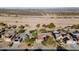 Aerial view of house and neighborhood; solar panels on roof at 18932 N Aztec Point Dr, Surprise, AZ 85387