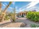 A charming backyard with patio features desert landscaping and covered area for entertaining at 18932 N Aztec Point Dr, Surprise, AZ 85387