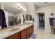 Double vanity bathroom with walk-in closet and shower at 18932 N Aztec Point Dr, Surprise, AZ 85387