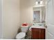 Clean bathroom with a single sink vanity and toilet at 18932 N Aztec Point Dr, Surprise, AZ 85387