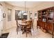 Cozy dining nook with a round table, wood chairs, and natural lighting at 18932 N Aztec Point Dr, Surprise, AZ 85387
