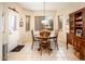 Warm dining nook with backyard view with table, chairs, and wood cabinet at 18932 N Aztec Point Dr, Surprise, AZ 85387