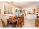 Traditional dining room featuring a wood table with seating for six at 18932 N Aztec Point Dr, Surprise, AZ 85387