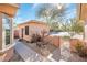 Exterior view of a home with desert landscaping, a fenced courtyard, and a separate casita at 18932 N Aztec Point Dr, Surprise, AZ 85387