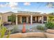 Home exterior showcasing a covered patio and solar panels at 18932 N Aztec Point Dr, Surprise, AZ 85387