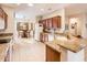 Spacious kitchen with granite countertops and warm wood cabinetry at 18932 N Aztec Point Dr, Surprise, AZ 85387