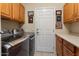 Laundry room with washer, dryer, and cabinets at 18932 N Aztec Point Dr, Surprise, AZ 85387
