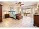 This main bedroom is decorated with earth tones, with a comfortable bed and bay windows at 18932 N Aztec Point Dr, Surprise, AZ 85387