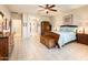 The main bedroom has tile flooring and a lovely color palette at 18932 N Aztec Point Dr, Surprise, AZ 85387