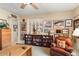 Home office with built-in shelving and comfortable seating at 18932 N Aztec Point Dr, Surprise, AZ 85387