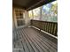 Wooden balcony overlooking green trees at 200 E Southern Ave # 242, Tempe, AZ 85282