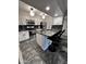 Updated kitchen featuring a black granite countertop, white cabinets, and stainless steel appliances at 200 E Southern Ave # 242, Tempe, AZ 85282