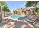 Community pool with surrounding deck and lounge chairs at 200 E Southern Ave # 242, Tempe, AZ 85282
